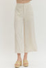 Solid woven pants featuring front patch pockets and zip-fly with button closure