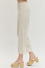Solid woven pants featuring front patch pockets and zip-fly with button closure
