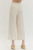 Solid woven pants featuring front patch pockets and zip-fly with button closure