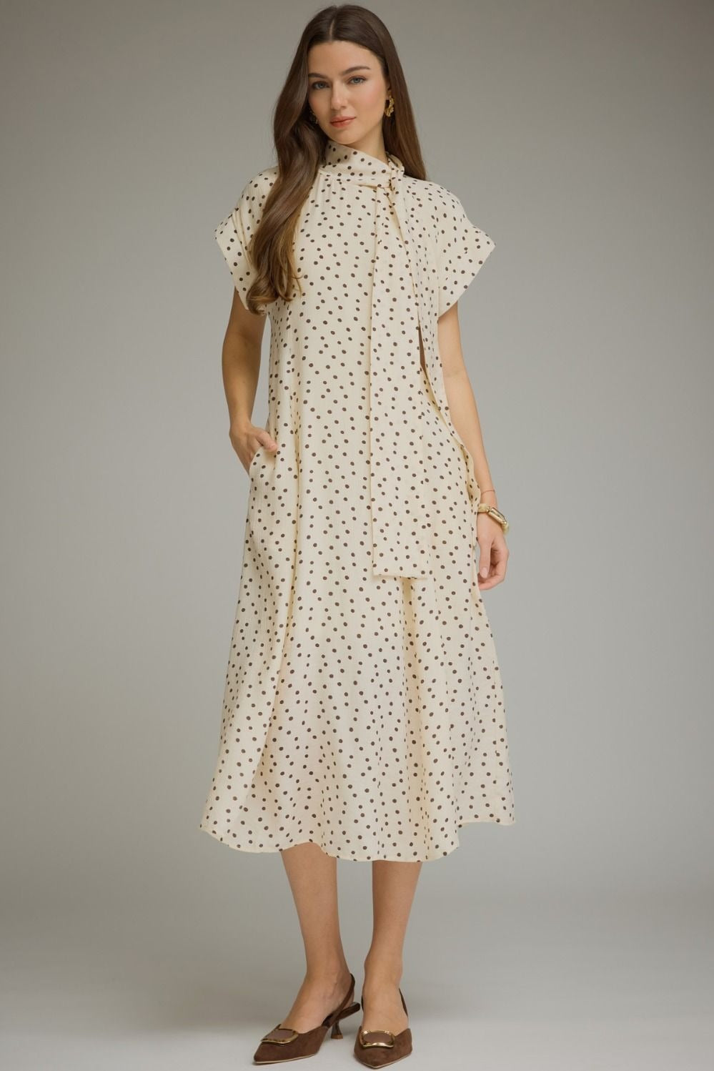 Polka dot short sleeve midi dress featuring a self-tie neck