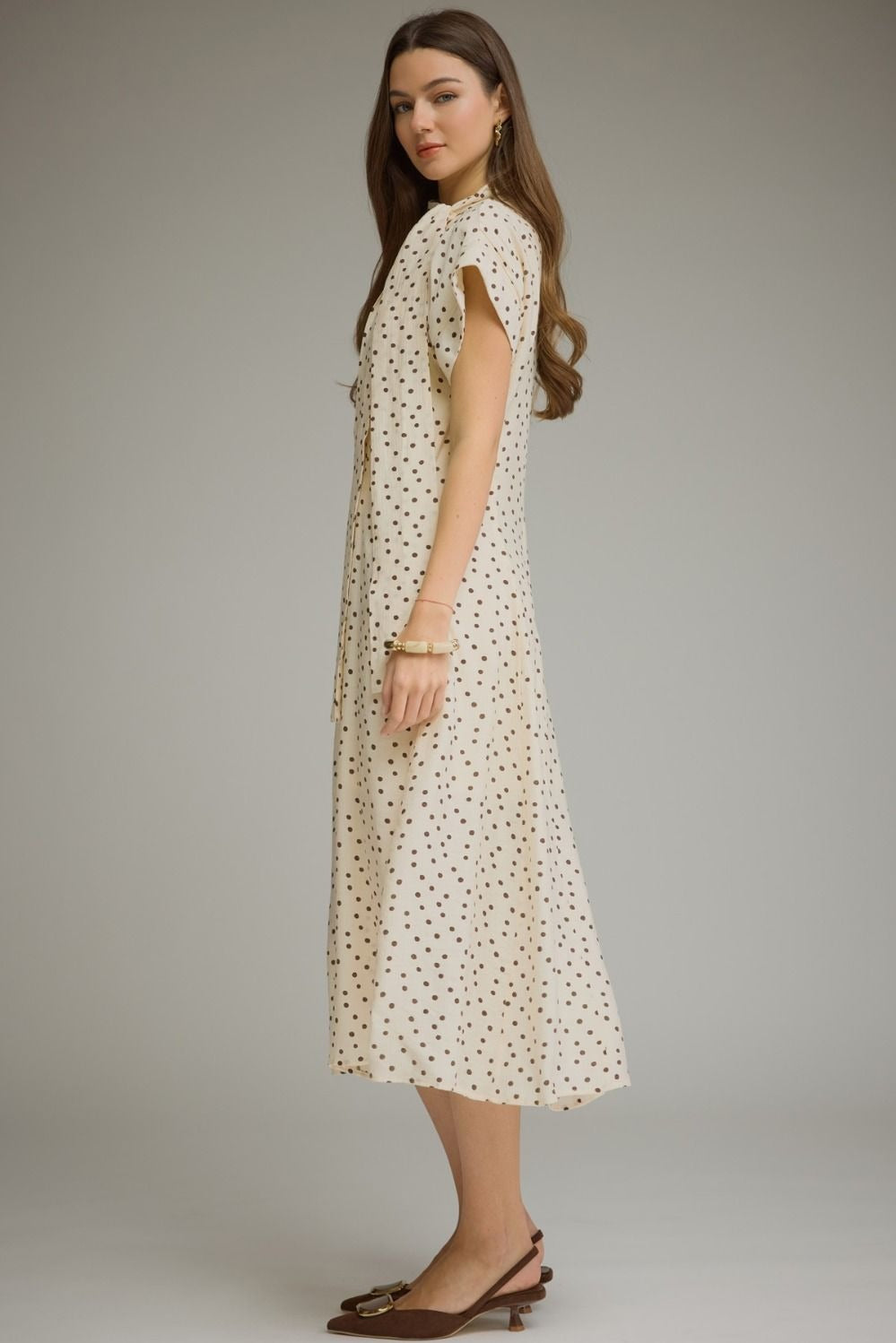 Polka dot short sleeve midi dress featuring a self-tie neck