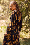 Floral printed tiered maxi dress with elastic waist and buttoned neckline