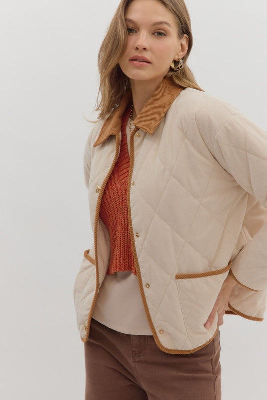 Diamond pattern quilted jacket with contrast collar adn binding detail