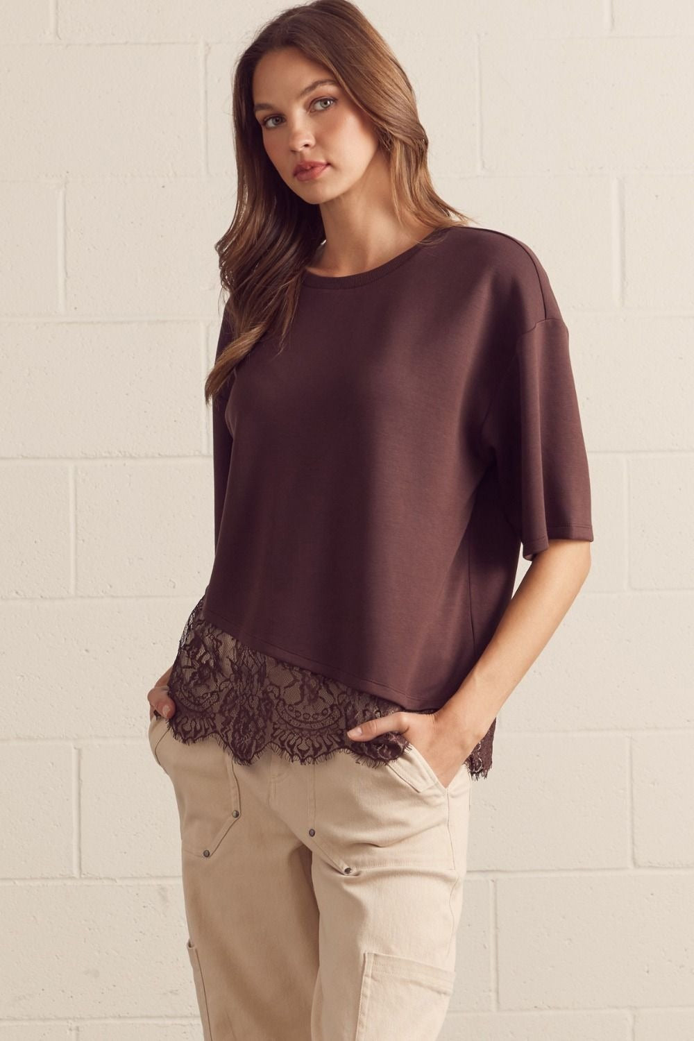 Solid short sleeve knit top featuring scallop lace hem detail