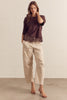 Solid short sleeve knit top featuring scallop lace hem detail