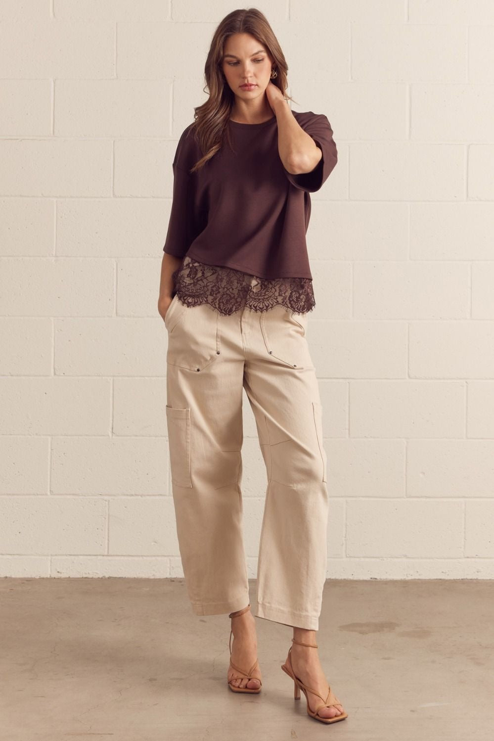 Solid short sleeve knit top featuring scallop lace hem detail
