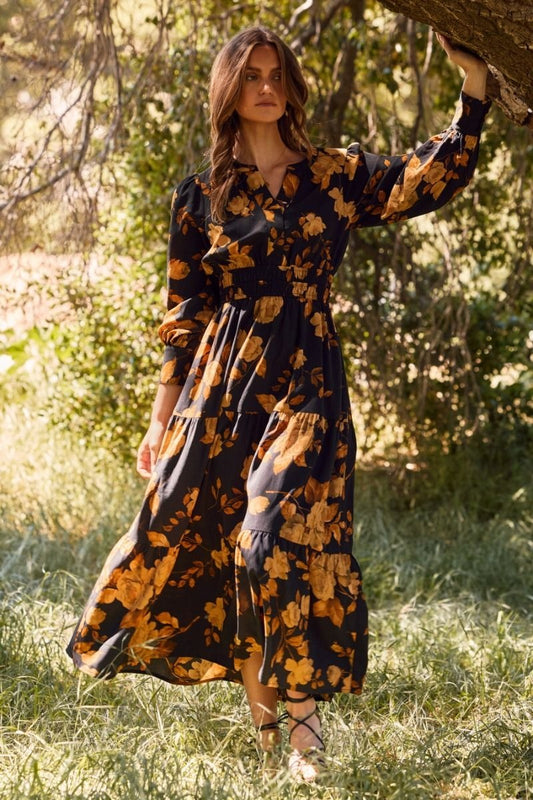 Floral printed tiered maxi dress with elastic waist and buttoned neckline