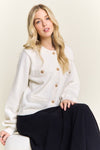 Shimmering gold-button front cardigan sweater