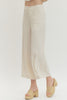Solid woven pants featuring front patch pockets and zip-fly with button closure