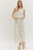 Solid woven pants featuring front patch pockets and zip-fly with button closure