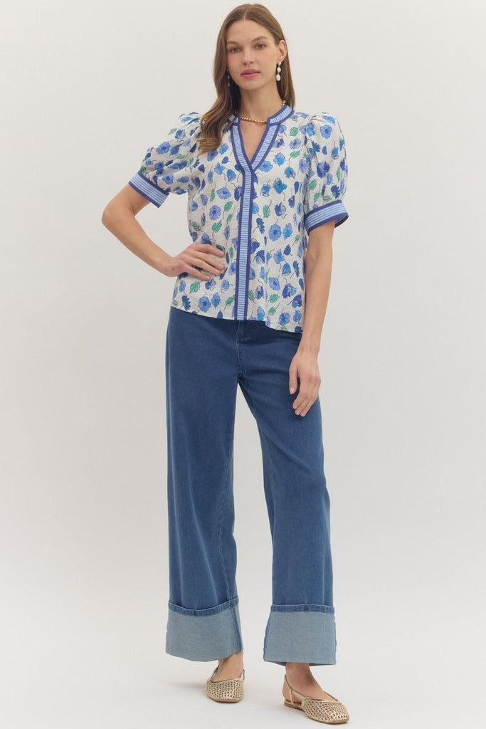 Floral print short puff sleeve top featuring contrast striped binding along V-neck