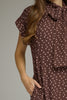 Polka dot short sleeve midi dress featuring a self-tie neck
