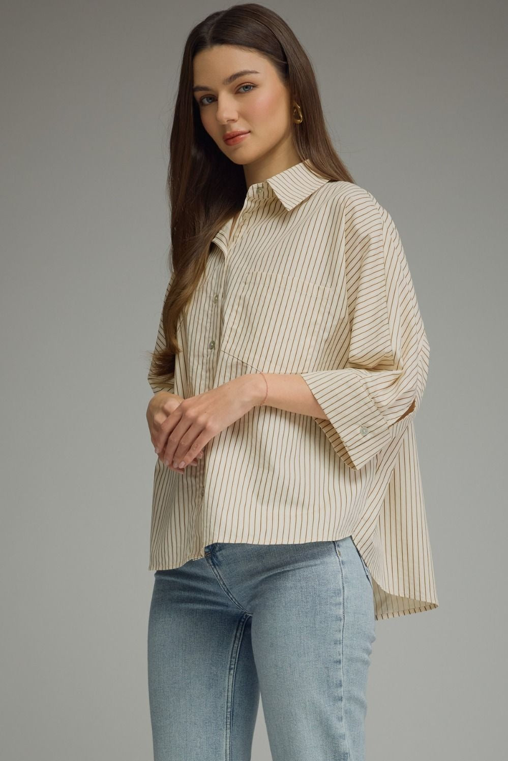 Stripe ¾ sleeve top featuring front pocket detail