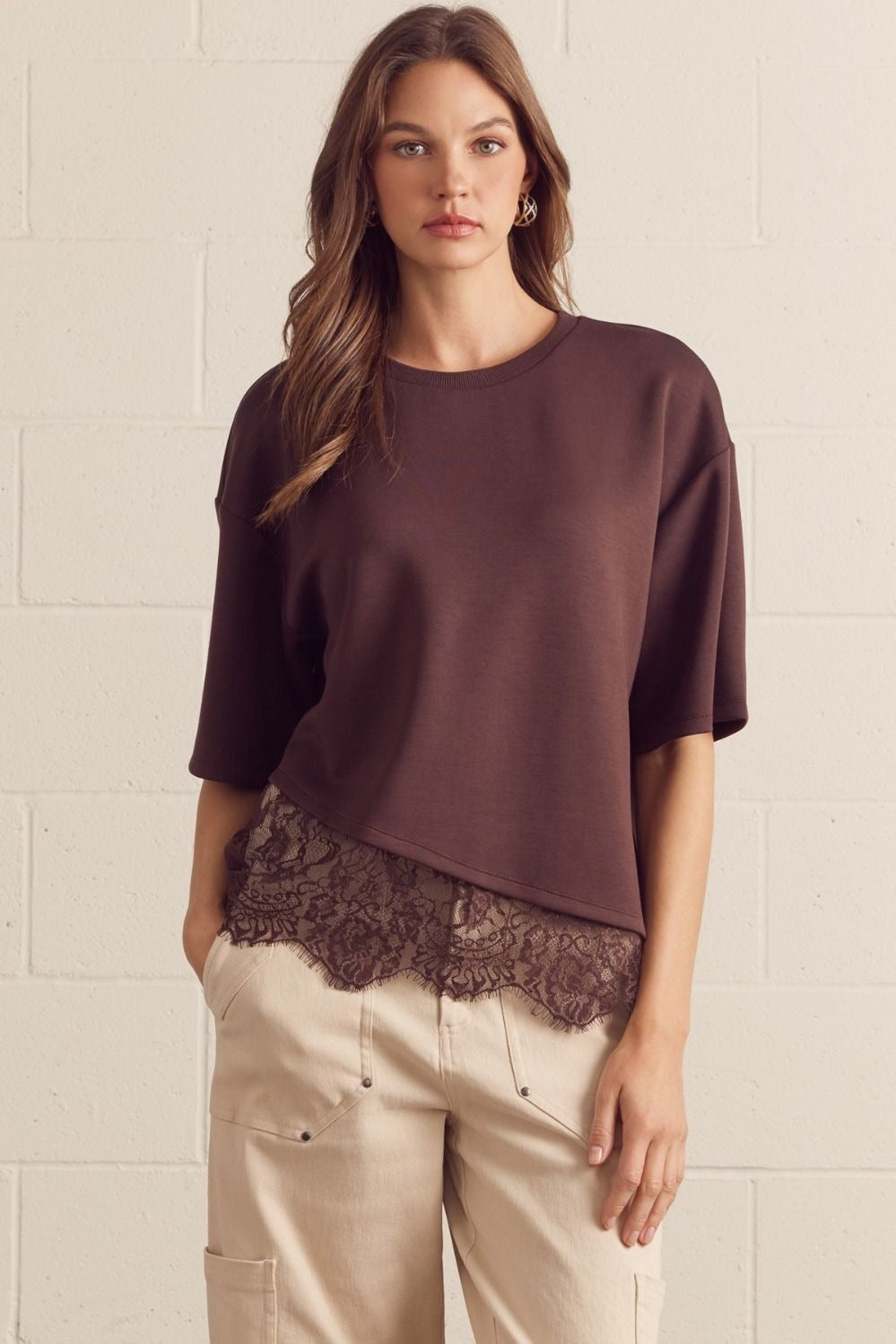 Solid short sleeve knit top featuring scallop lace hem detail