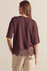 Solid short sleeve knit top featuring scallop lace hem detail