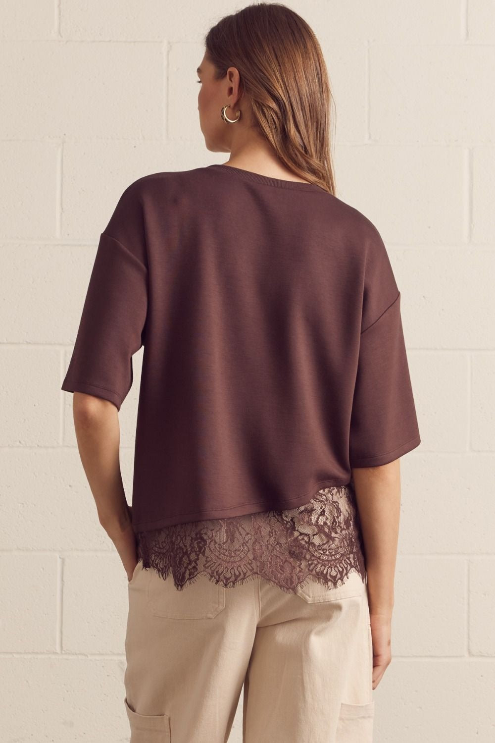 Solid short sleeve knit top featuring scallop lace hem detail