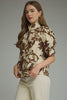 Printed short puff sleeve top featuring button closure at front