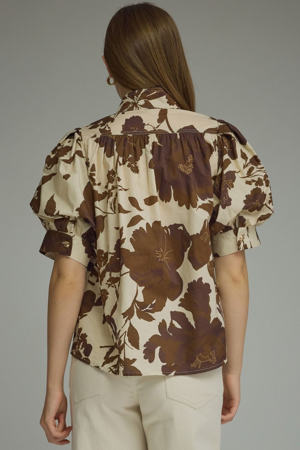 Printed short puff sleeve top featuring button closure at front