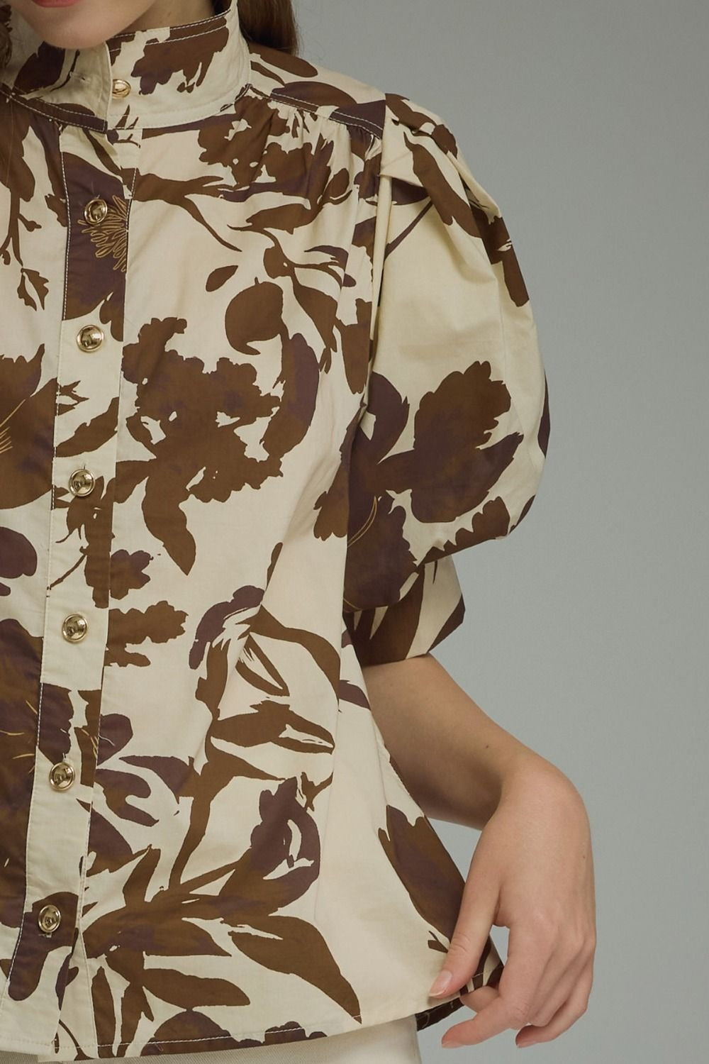 Printed short puff sleeve top featuring button closure at front
