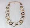 Gold and marbled tortoise-shell acetate ring necklace  Ivy and Pearl Boutique   