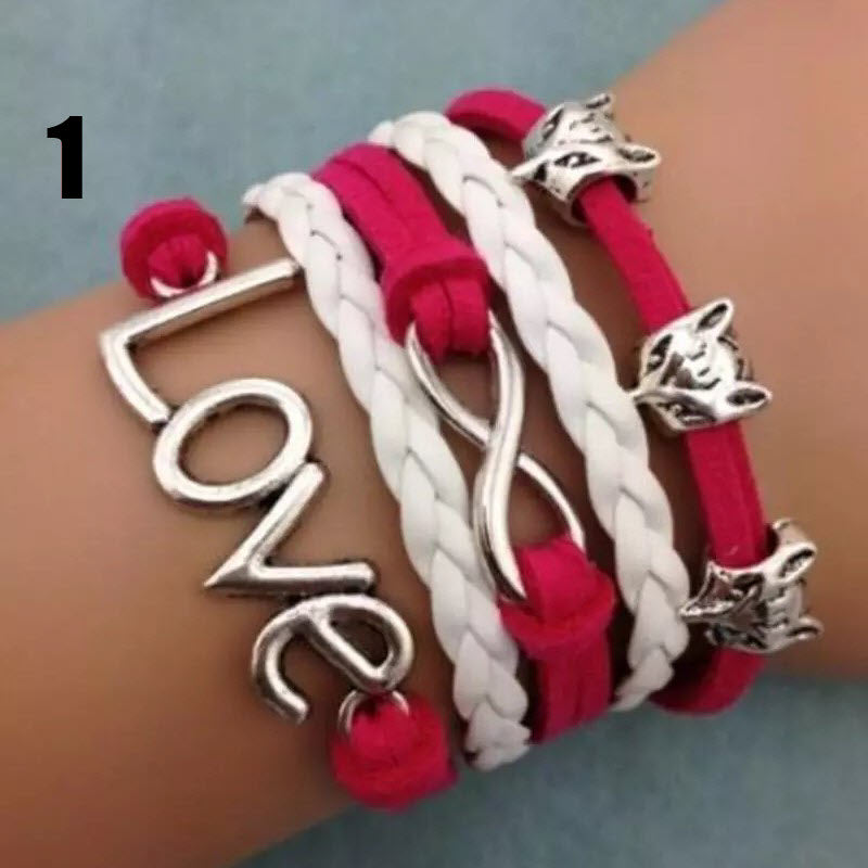 Handmade leather braided bracelet with variety of charms  Ivy and Pearl Boutique   