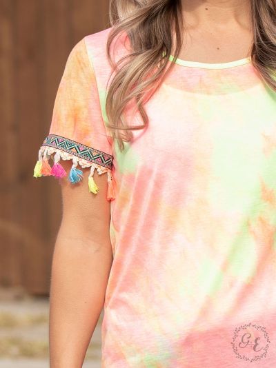 Sunny days tie-dye top with neon embroidery and fringe sleeves  Ivy and Pearl Boutique   