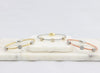 Twisted cable bracelet with square-clusters of diamond-like cubic zirconia stones  Ivy and Pearl Boutique Gold  