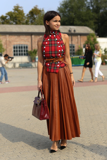 Pleated skirt with untucked shirt and cinched belt