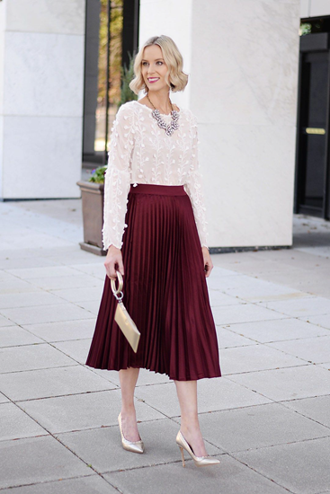 Wine pleated skirt with lace top and statement necklace and purse